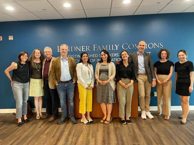 Group photo in front of sign