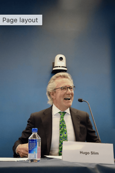 Hugo Slim speaking into microphone